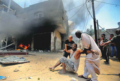 O desespero perante a destruição de um edifício de habitação em Shajaya, Cidade de Gaza